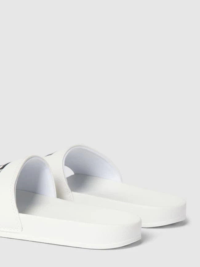 Levi’s® Acc. Slides Mit Label-Print Modell 'JUNE BATWING' - Weiß 2 Levi’s® Acc. Slides Mit Label-Print Modell 'JUNE BATWING' - Weiß – Bild 2