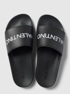 Valentino Slides Mit Label-Detail Modell 'XENIA' - Schwarz -Modegeschäft Für Damenschuhe a983cgpha0o48ga29grk8hi59tal0jq9917k2c23ad230j2lap4j6e1pa9152dag7584qca58so4ehij853jadb66koj8e36ccs68dpk6kq38ohh68s6adb3cdijecb3corjgog